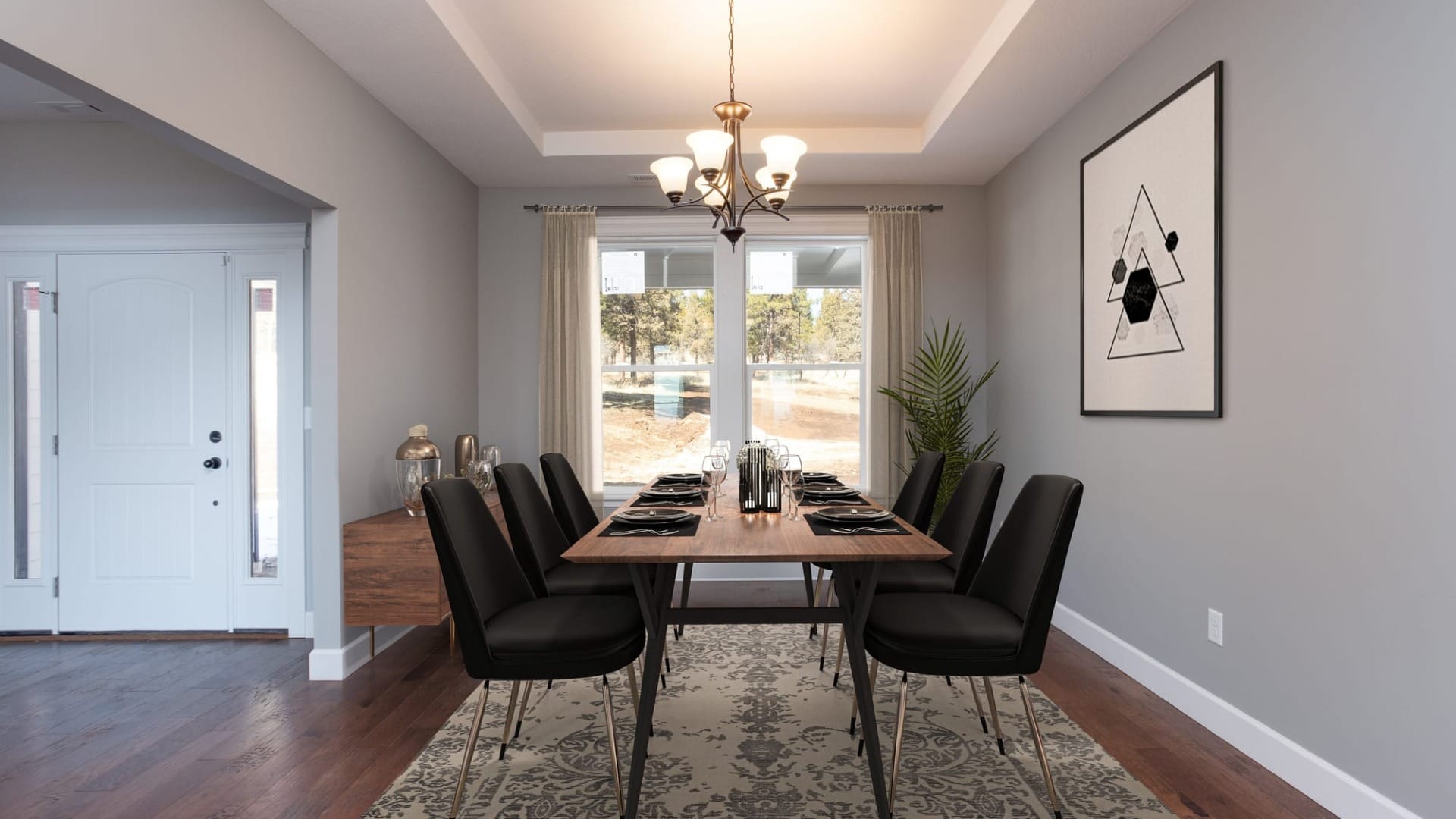 A dining room with a table all set up for a group of people
