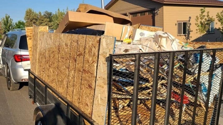 A car trailer filled with wood