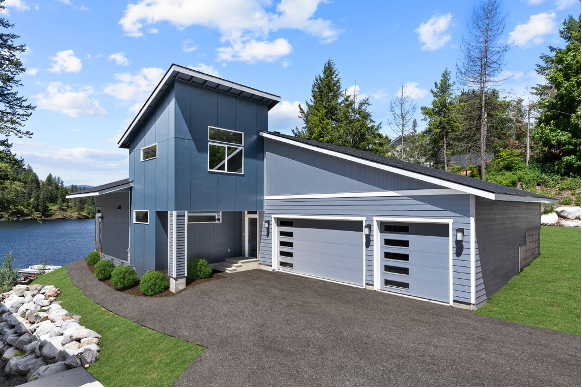 Modern two story custom home with contemporary exterior design on a scenic property, built by professional custom home builders Spokane residents rely on