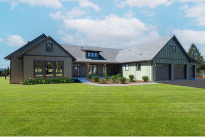Single-story craftsman-style custom home with dark siding, attached garage, and expansive green lawn.