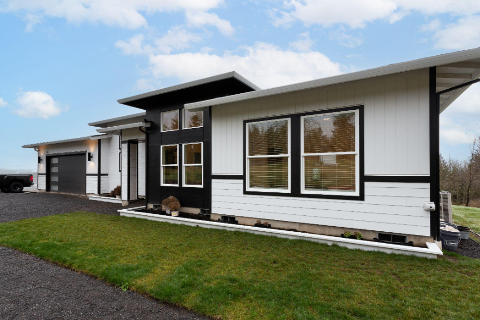 Modern custom home with clean lines, large windows, and contemporary exterior design