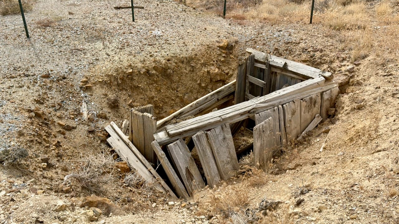 Collapsed shaft collar of above unnamed mine