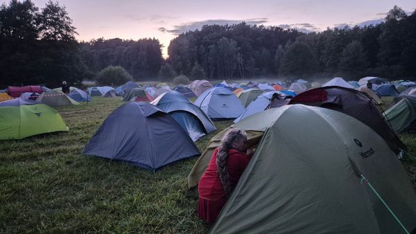 Peaceful tents in a foggy field.