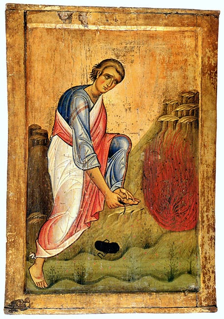 Byzantine icon on a gold ground of Moses bending to remove his sandal, one sandal already lying on the ground, beside a bush wreathed in red flame.