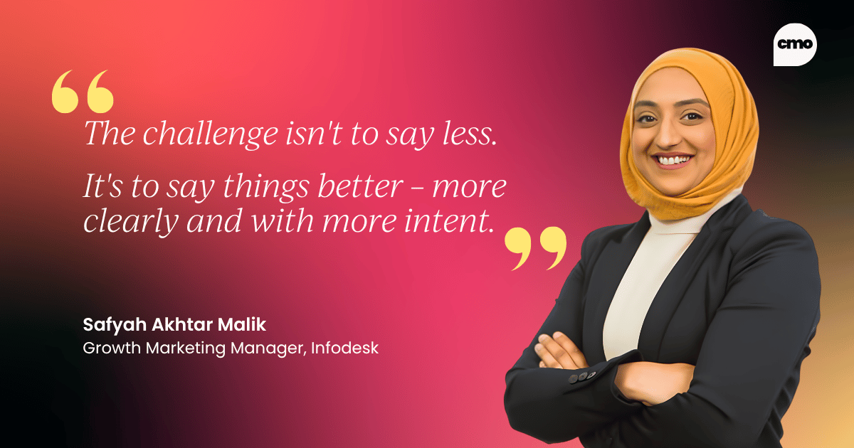 Branded CMO Alliance quote graphic featuring Safyah Akhtar Malik, Growth Marketing Manager at Infodesk, who says: "The challenge isn't to say less. It's to say things better – more clearly and with more intent." Safyah is pictured on the right side of the image, smiling with her arms crossed, against a dark gradient background in red and black tones.