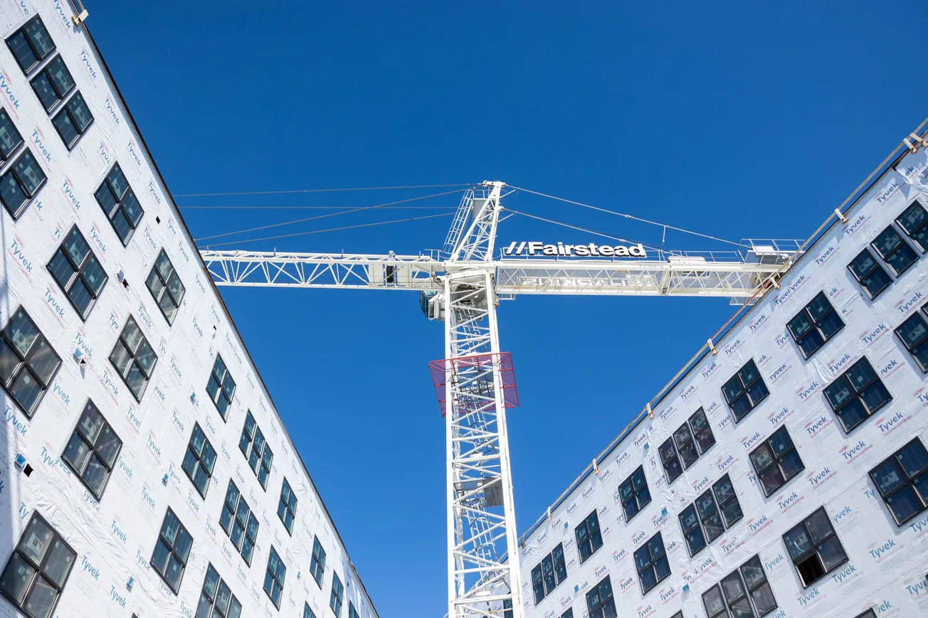 Samuel Madden Homes redevelopment tops out in Old Town, 11 months after groundbreaking