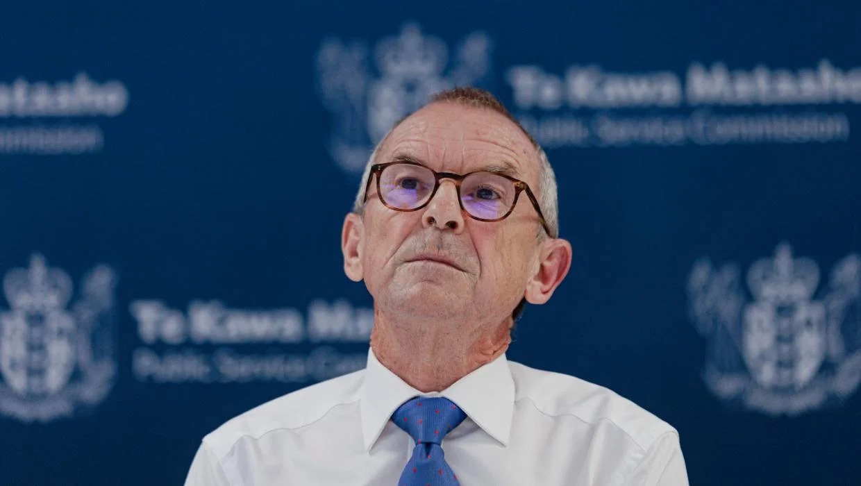 Public Service Commissioner Brian Roche looking up