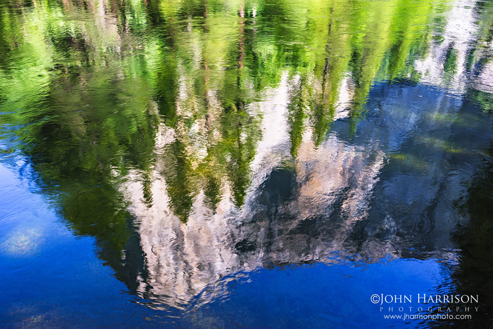El Capitan reflected in the Merced River with blue sky and green pines, Yosemite Valley fine art photograph in Yosemite National Park