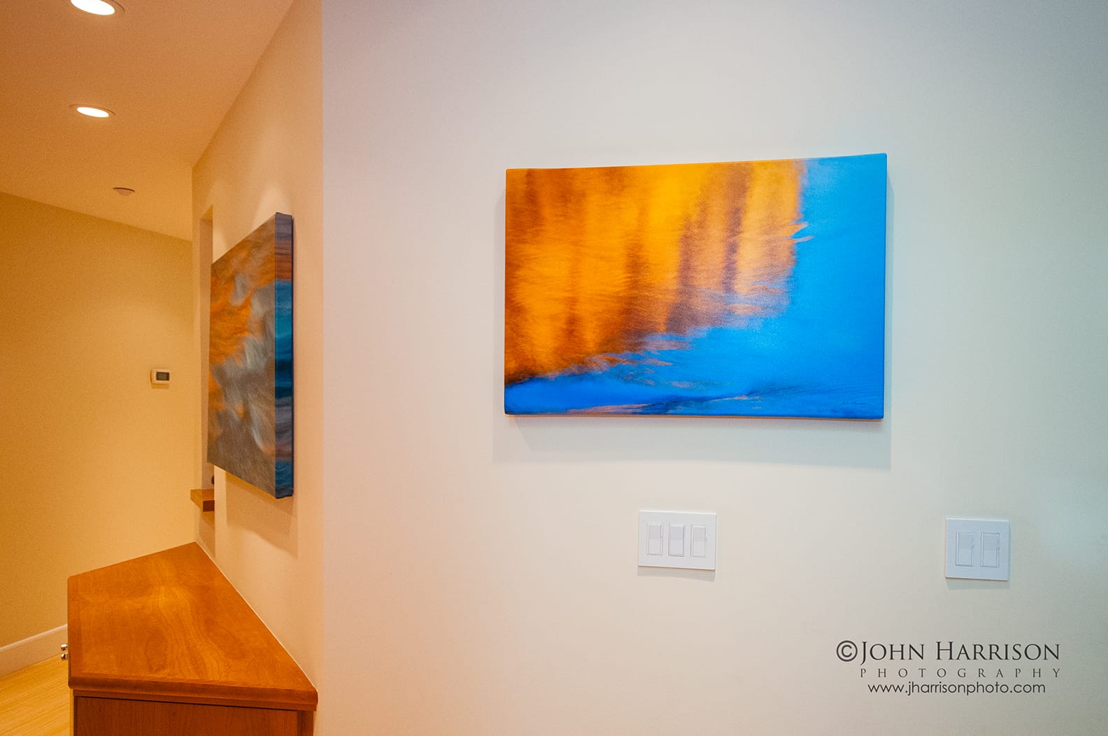Yosemite Renaissance fine art photography installation featuring Reflections of El Capitan at Sunset and Sunset Flowing displayed as canvas giclée prints in a modern residential hallway. Yosemite National Park Fine Art Photography