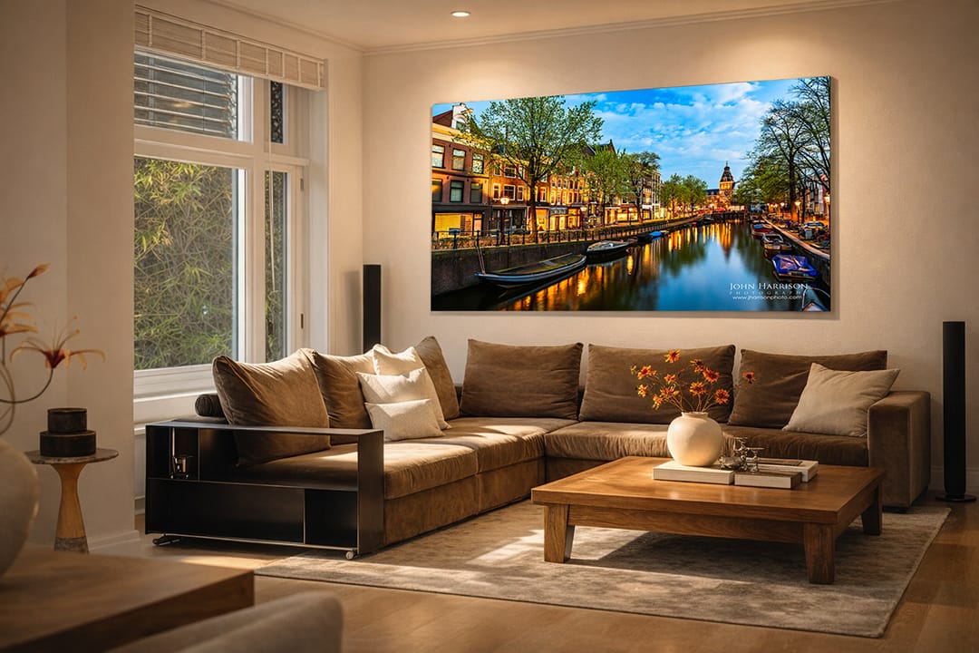 Large Amsterdam canal fine art print displayed in a modern living room as museum-quality wall art.