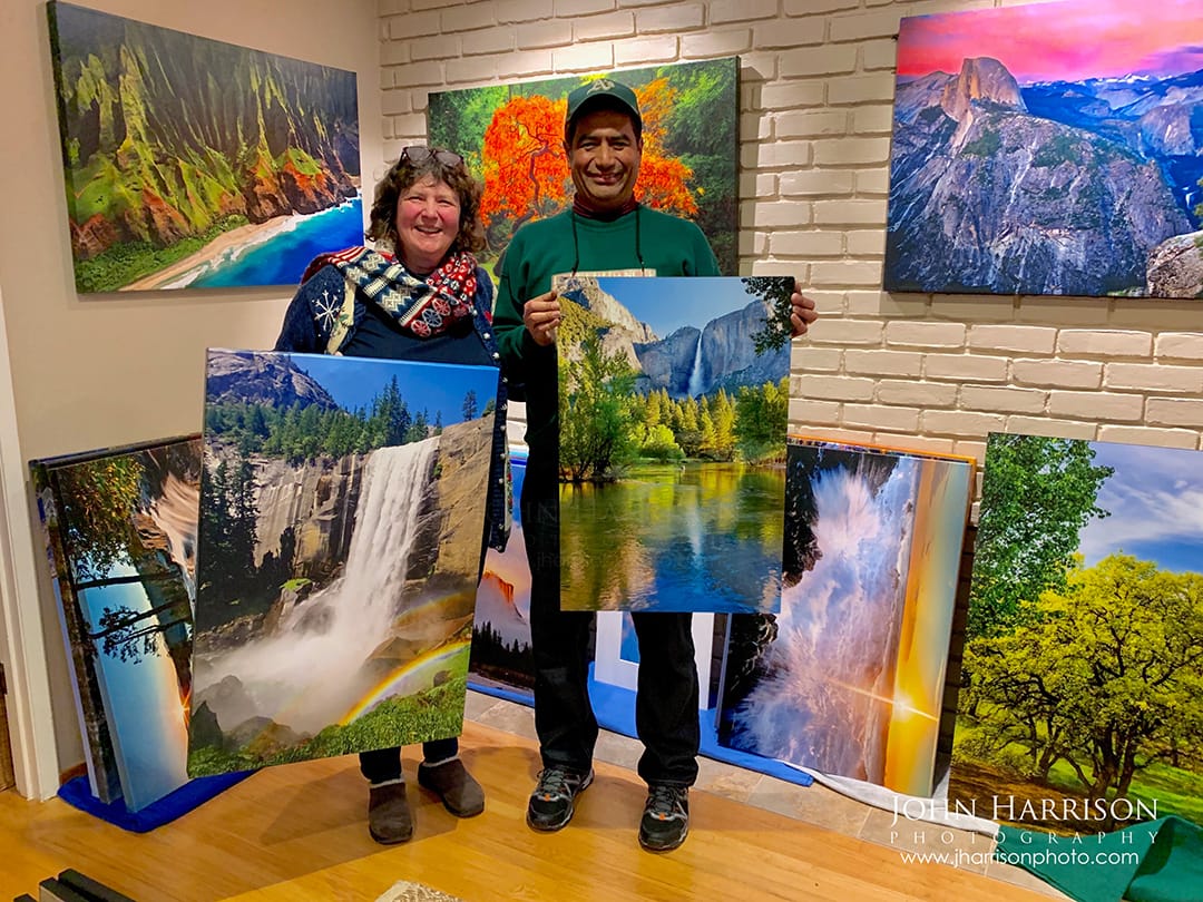 Collectors holding Yosemite fine art waterfall prints by John Harrison, including Vernal Fall and Yosemite Falls photography for home interiors.