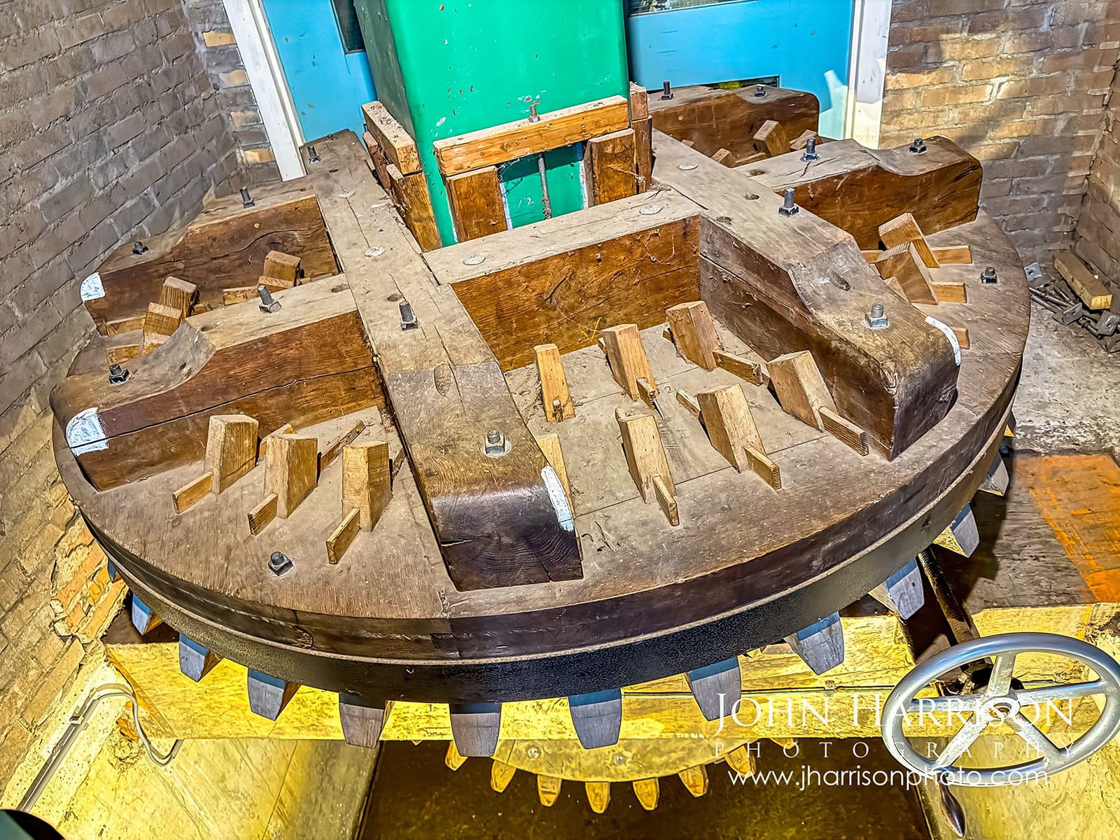 Historic wooden windmill gears and drive shaft inside Molen van Sloten pumping windmill in Amsterdam Netherlands.