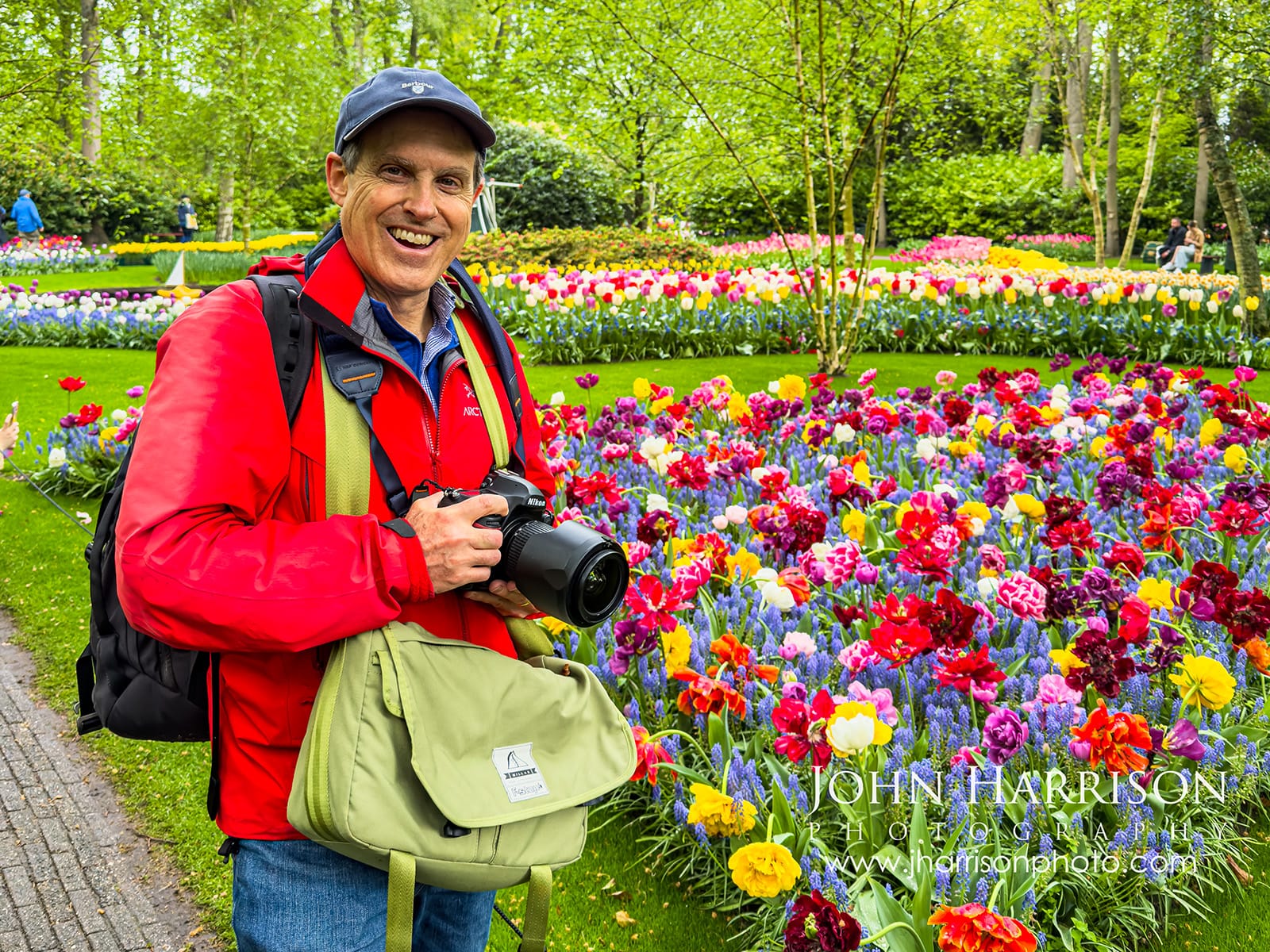 photographer with Nikon D850 at Keukenhof Gardens Netherlands surrounded by tulips May 2026