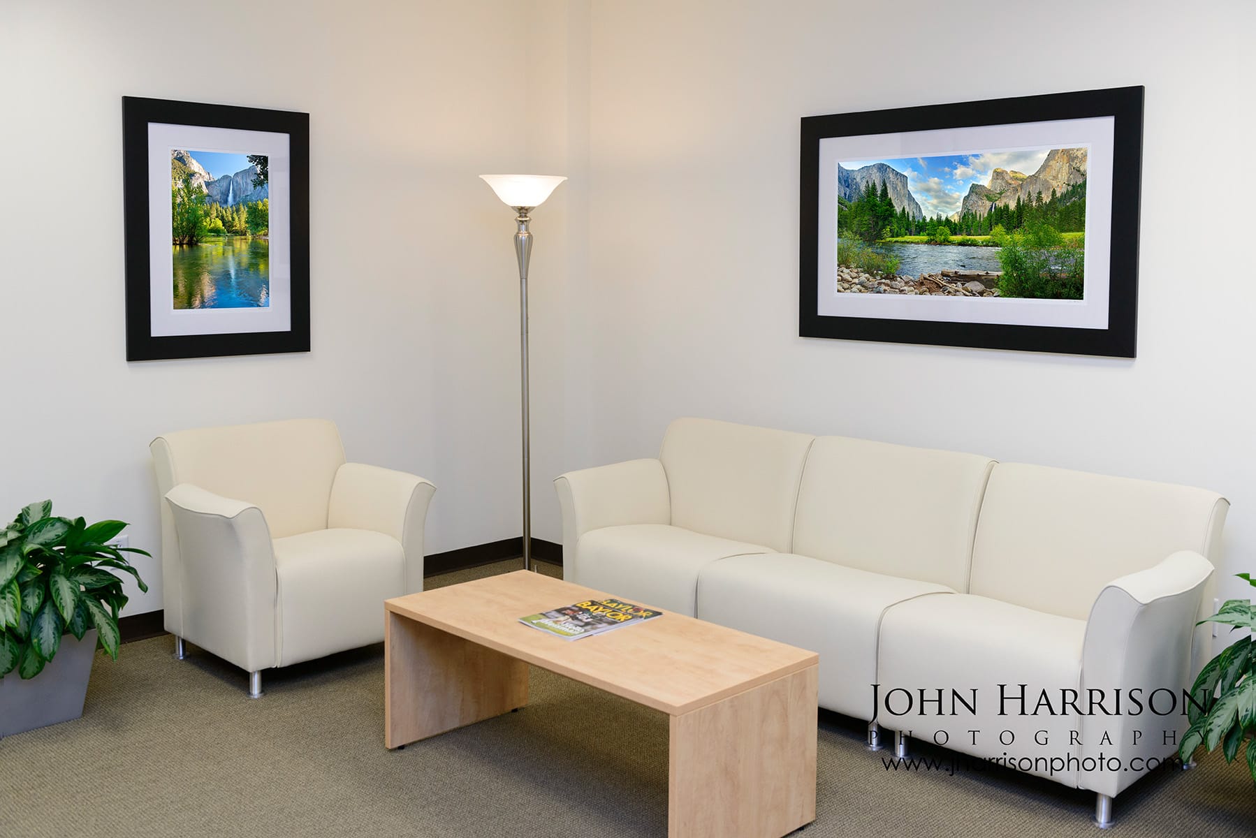Yosemite fine art photography installed in a modern office lobby with framed prints of Yosemite Falls and Valley View.