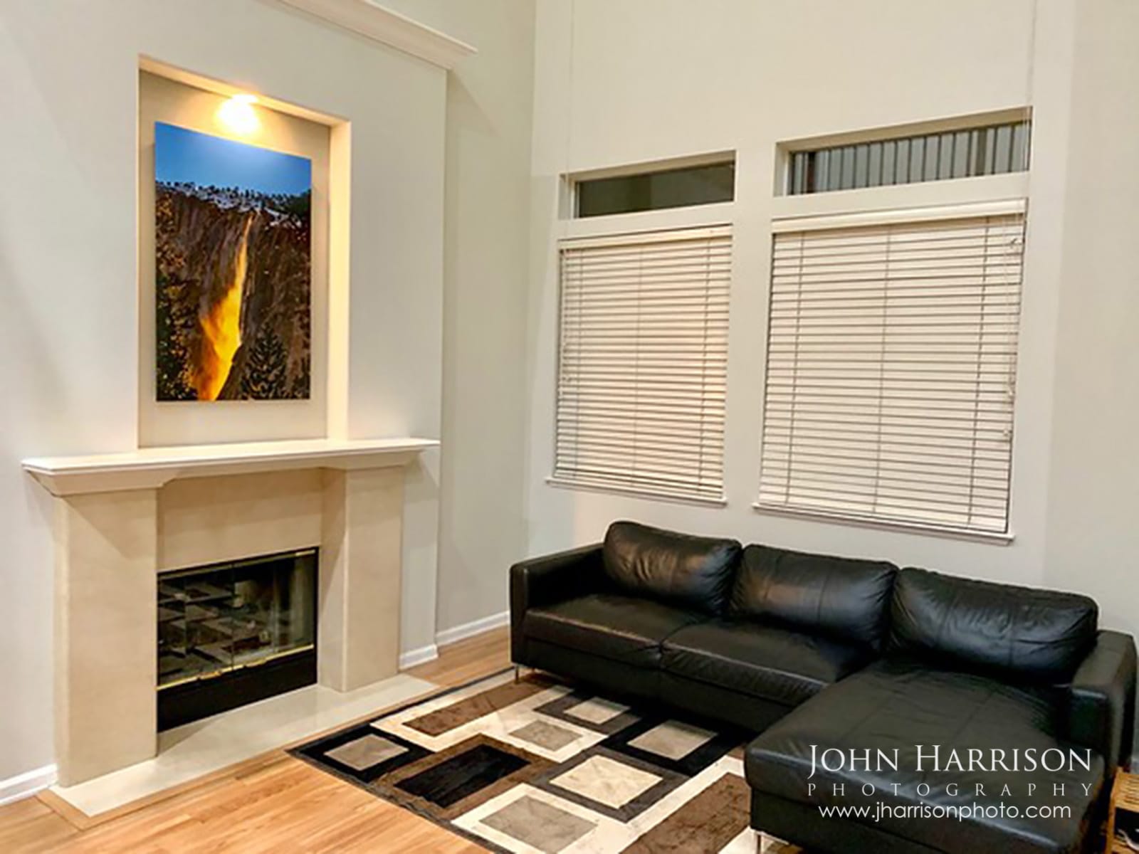 Yosemite Firefall fine art print displayed above a fireplace in a modern living room featuring Horsetail Fall glowing on El Capitan in Yosemite National Park.