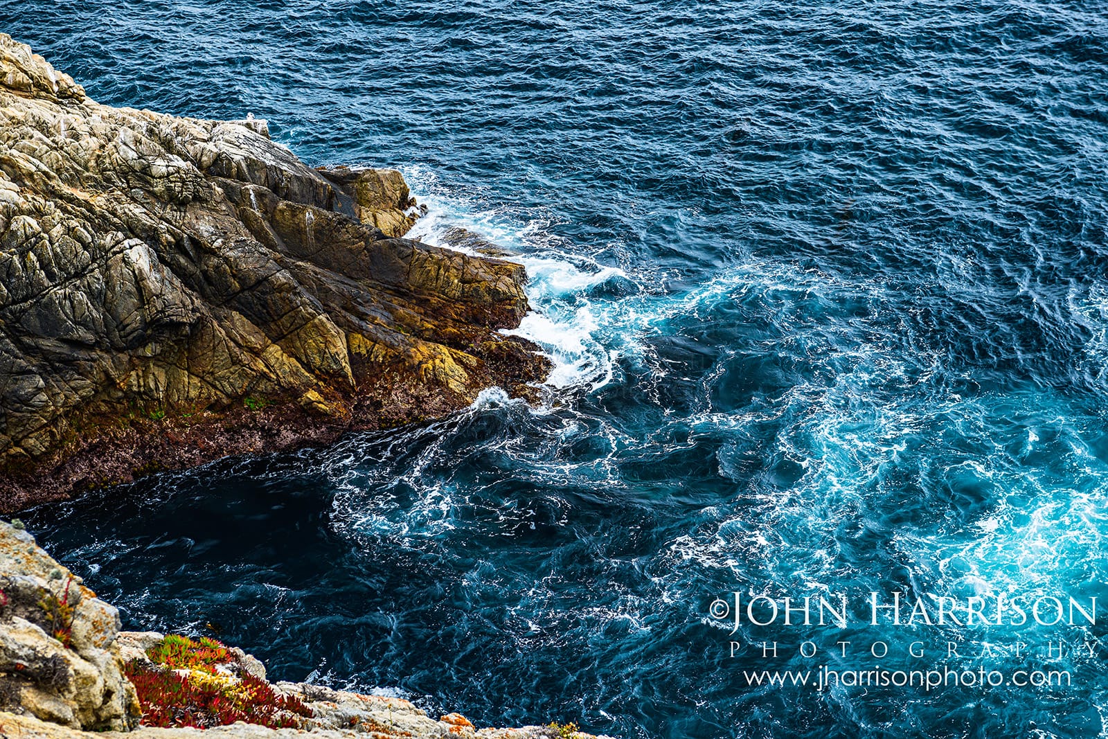 Deep blue Pacific Ocean swirling against the rocky shoreline at Pinnacle Cove along the Cypress Grove Trail in Point Lobos.