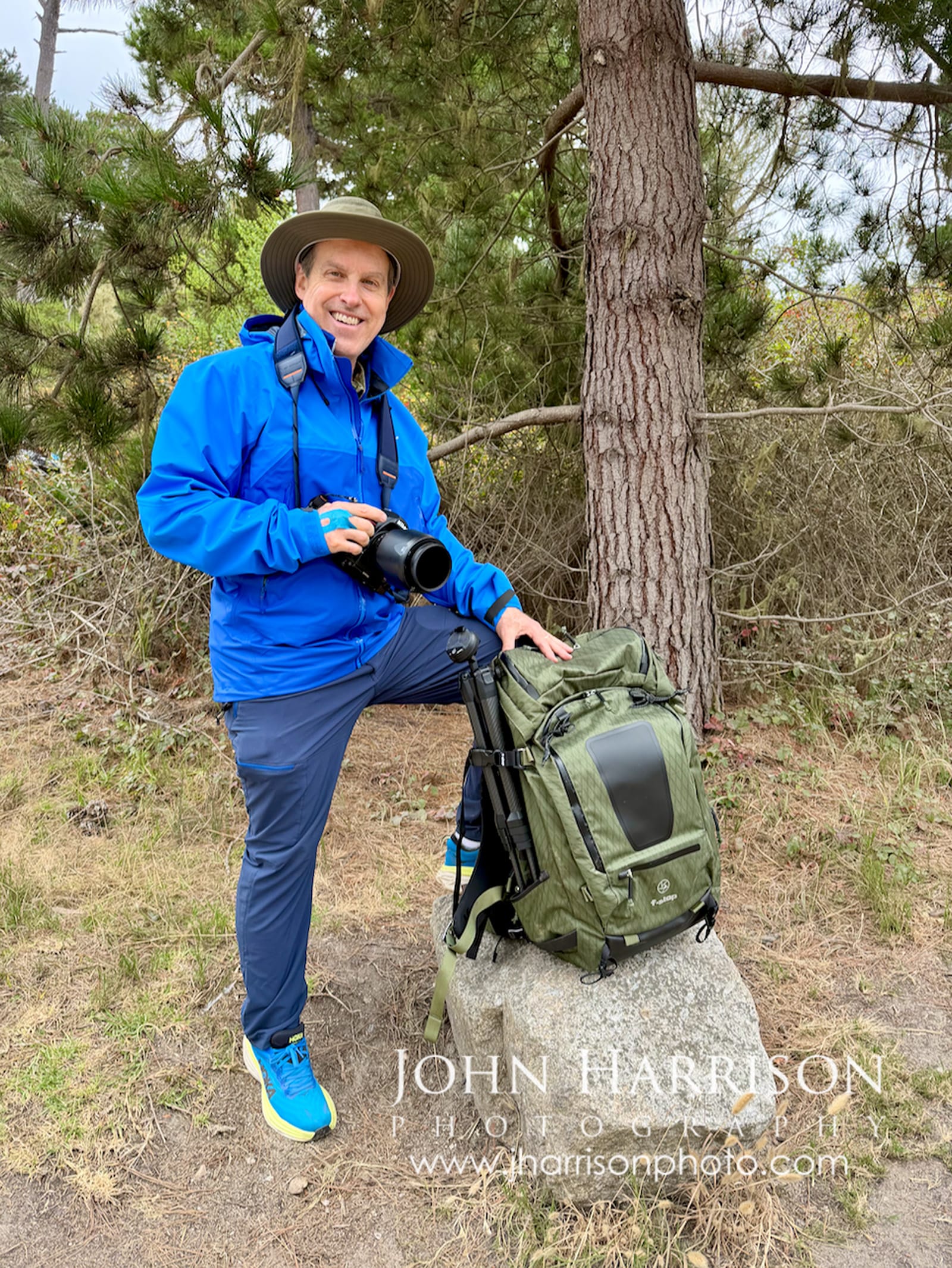 Landscape photographer John Harrison with Nikon camera and f-stop Tilopa pack at Point Lobos, California.