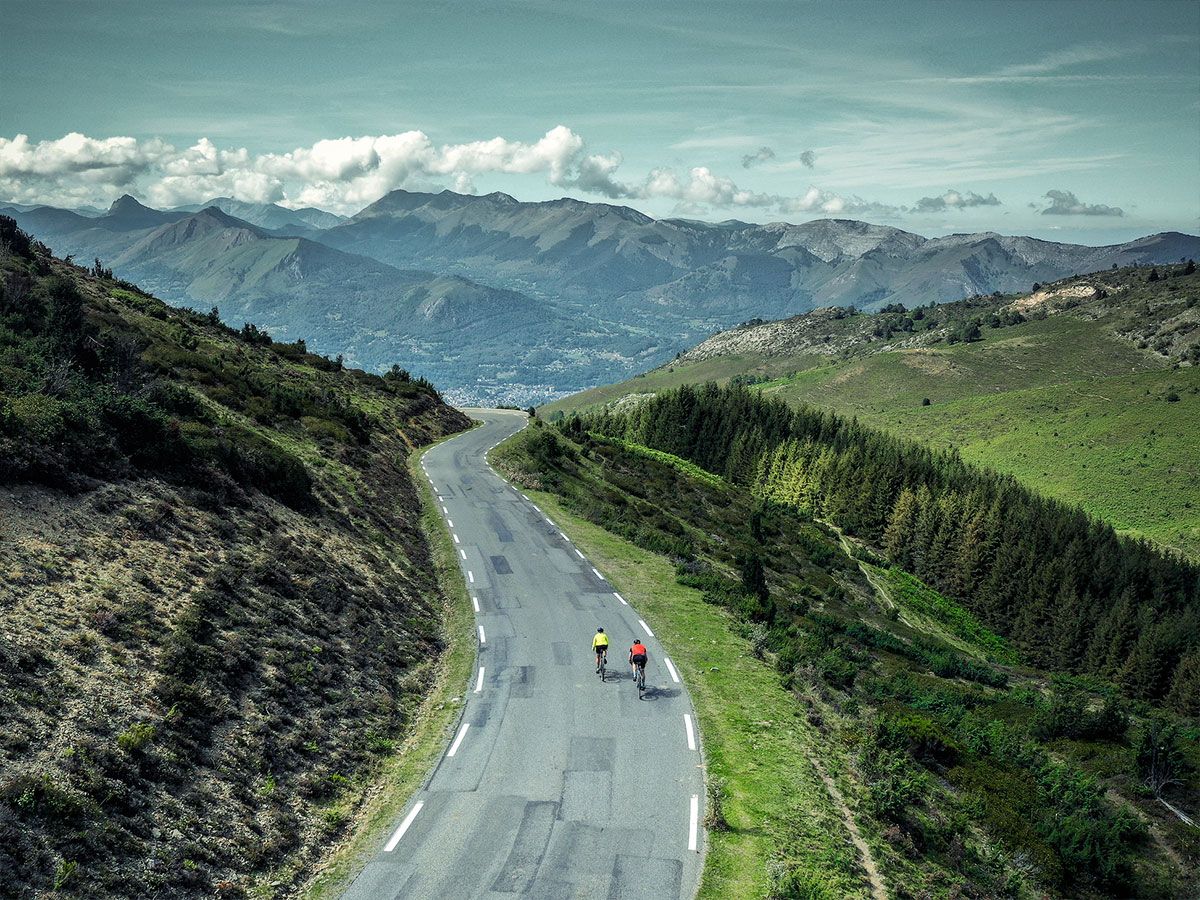 Cyclists cycling in the Pyrenees