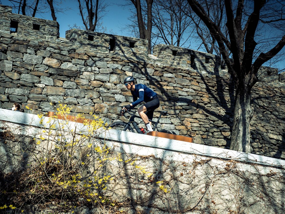 Male cyclist riding road bike abroad