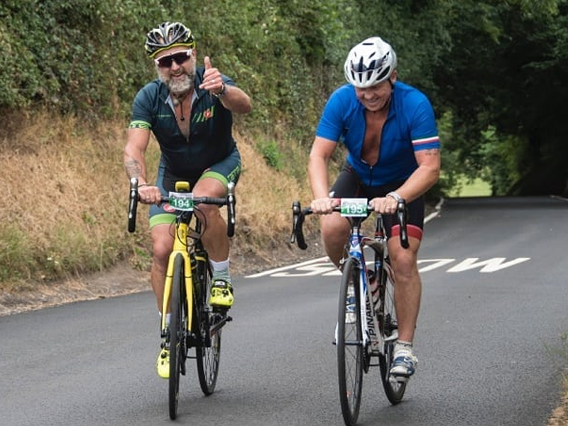 Cyclists riding uphill