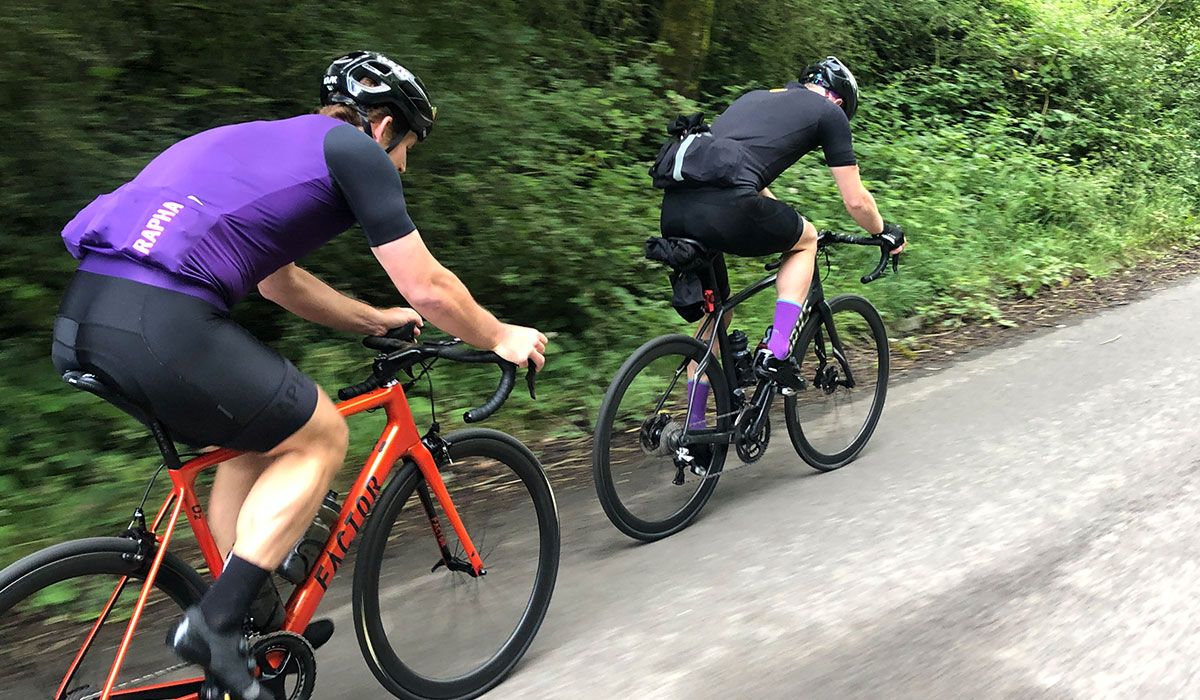 Two cyclists cycling together