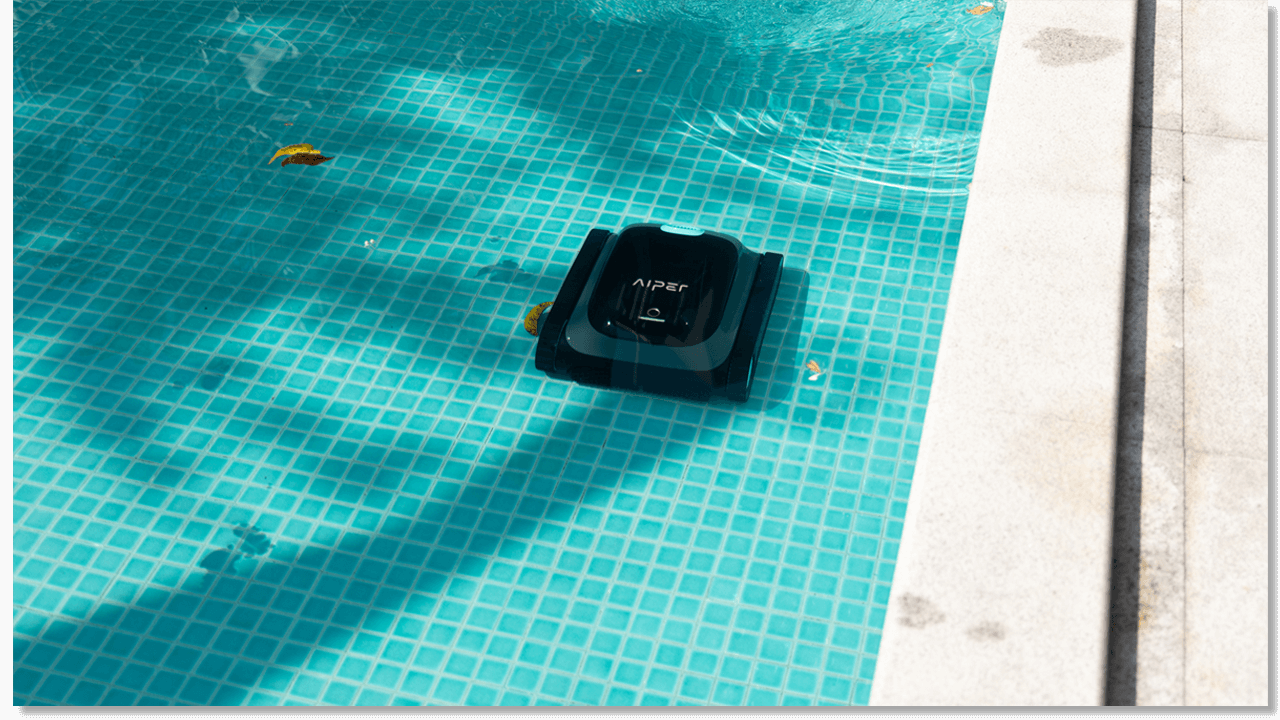 a cleaner is maintaining the swimming pool in summer