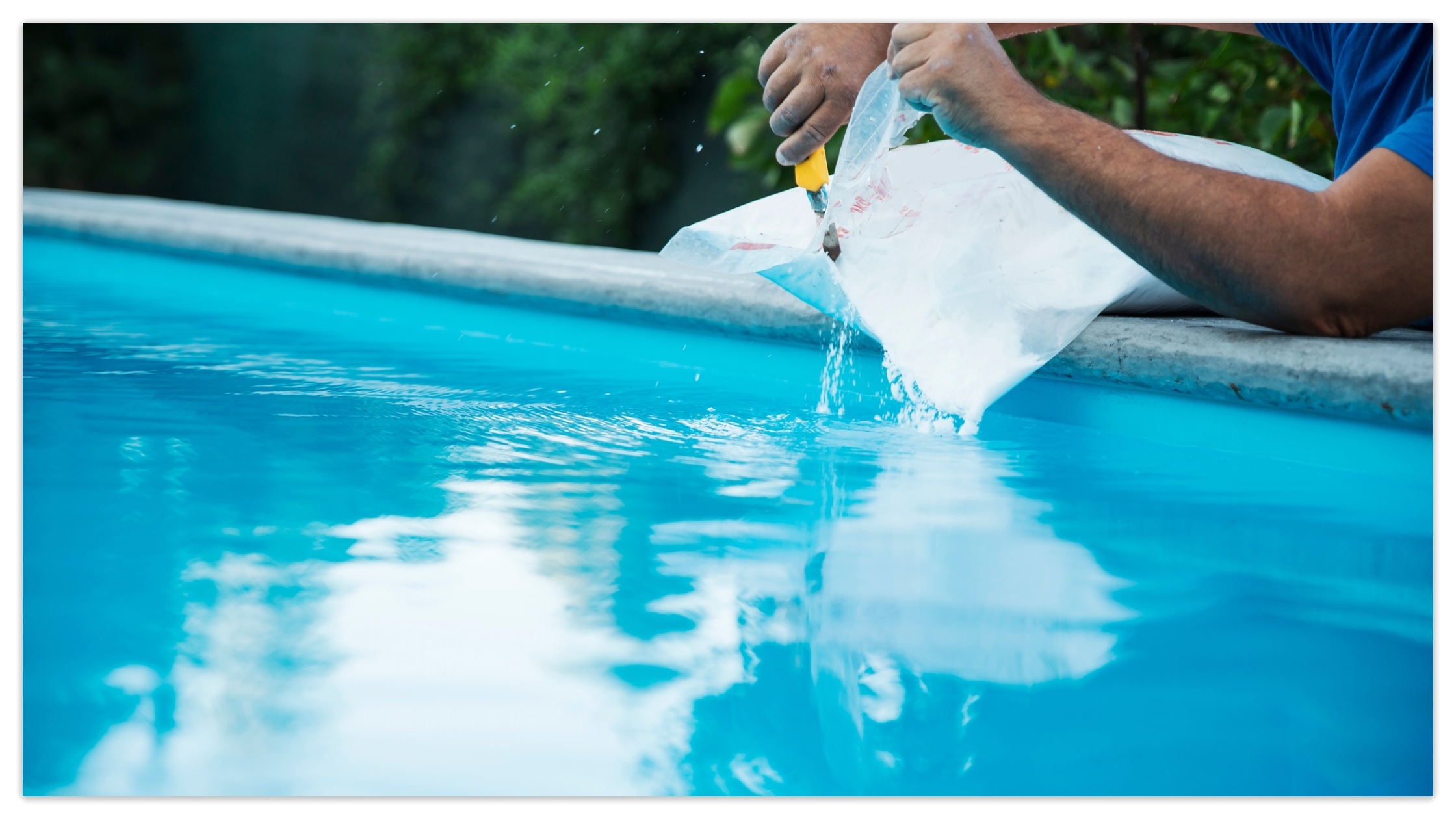 A worker adds salt to the pool.