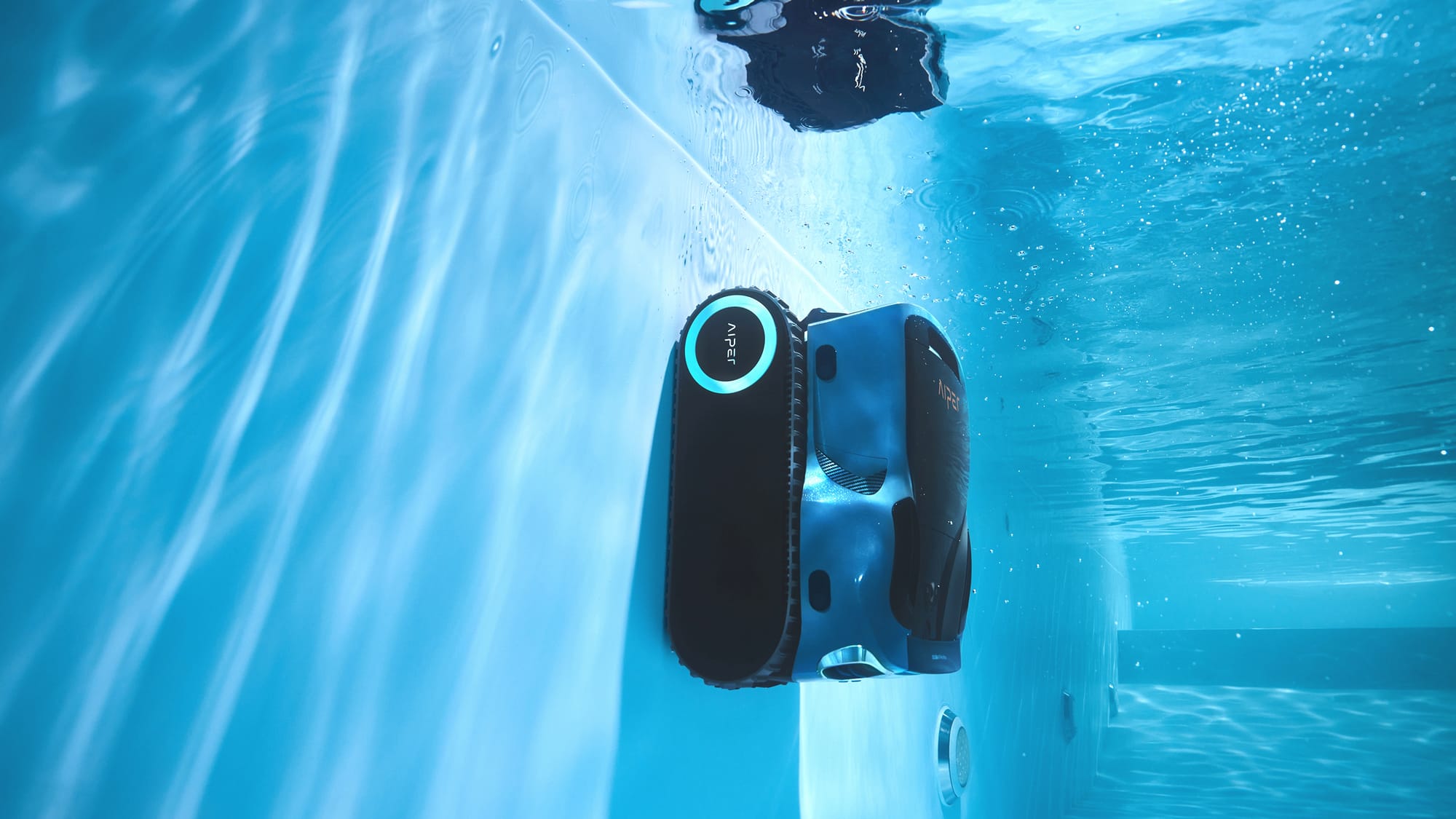 a pool cleaner is cleaning vinyl liner pool wall