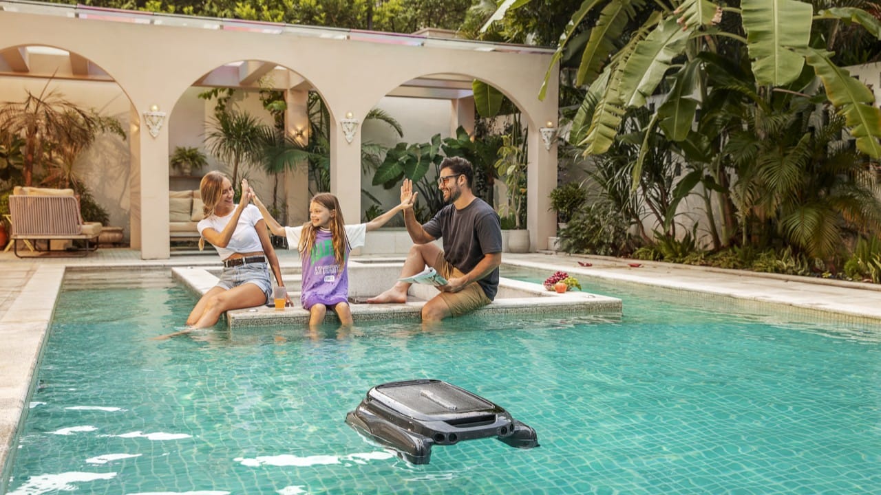 a pool skimmer is cleaning the pool surface