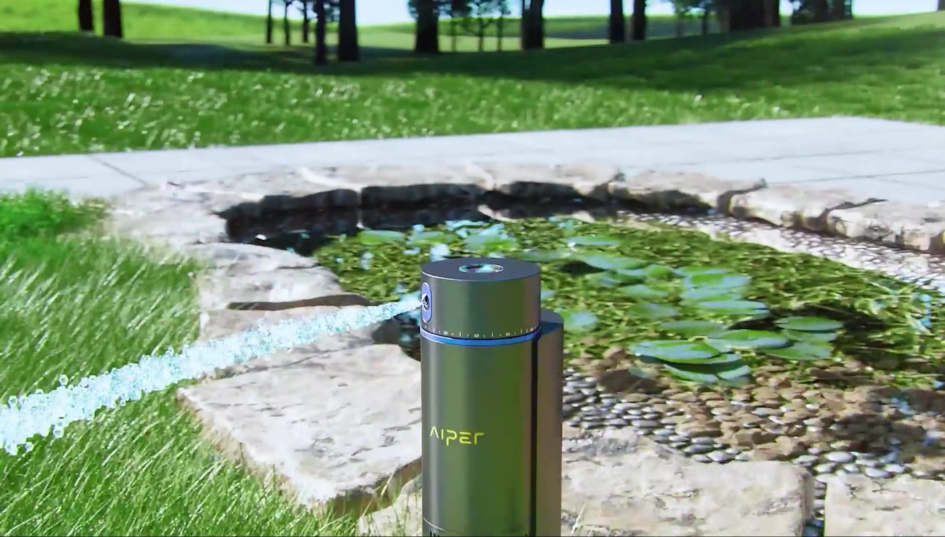 a lawn watering system, sprays water from a pond onto a green lawn.