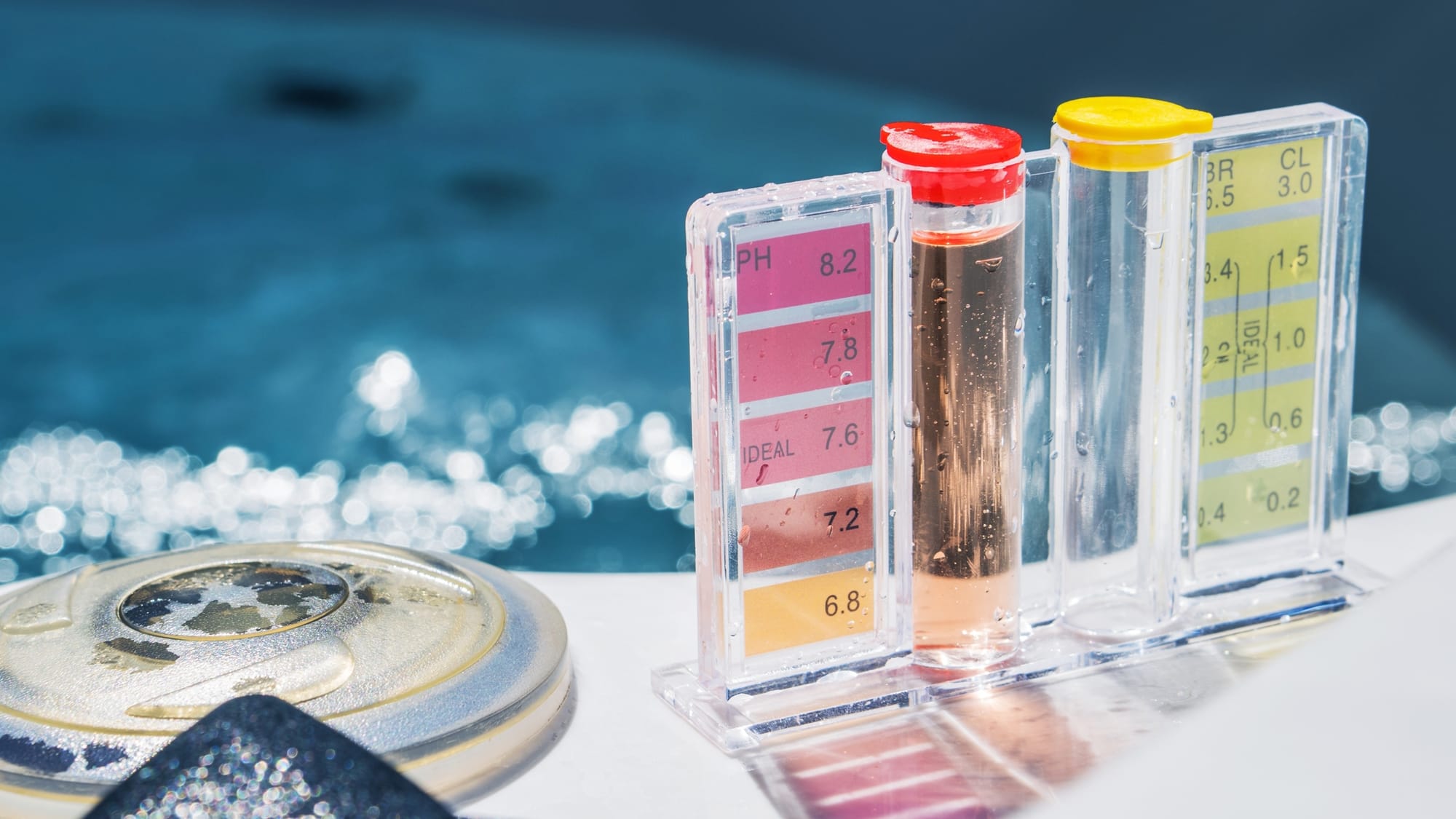 Pool water test kit to check pH and chlorine levels for winter pool maintenance in mild climates.