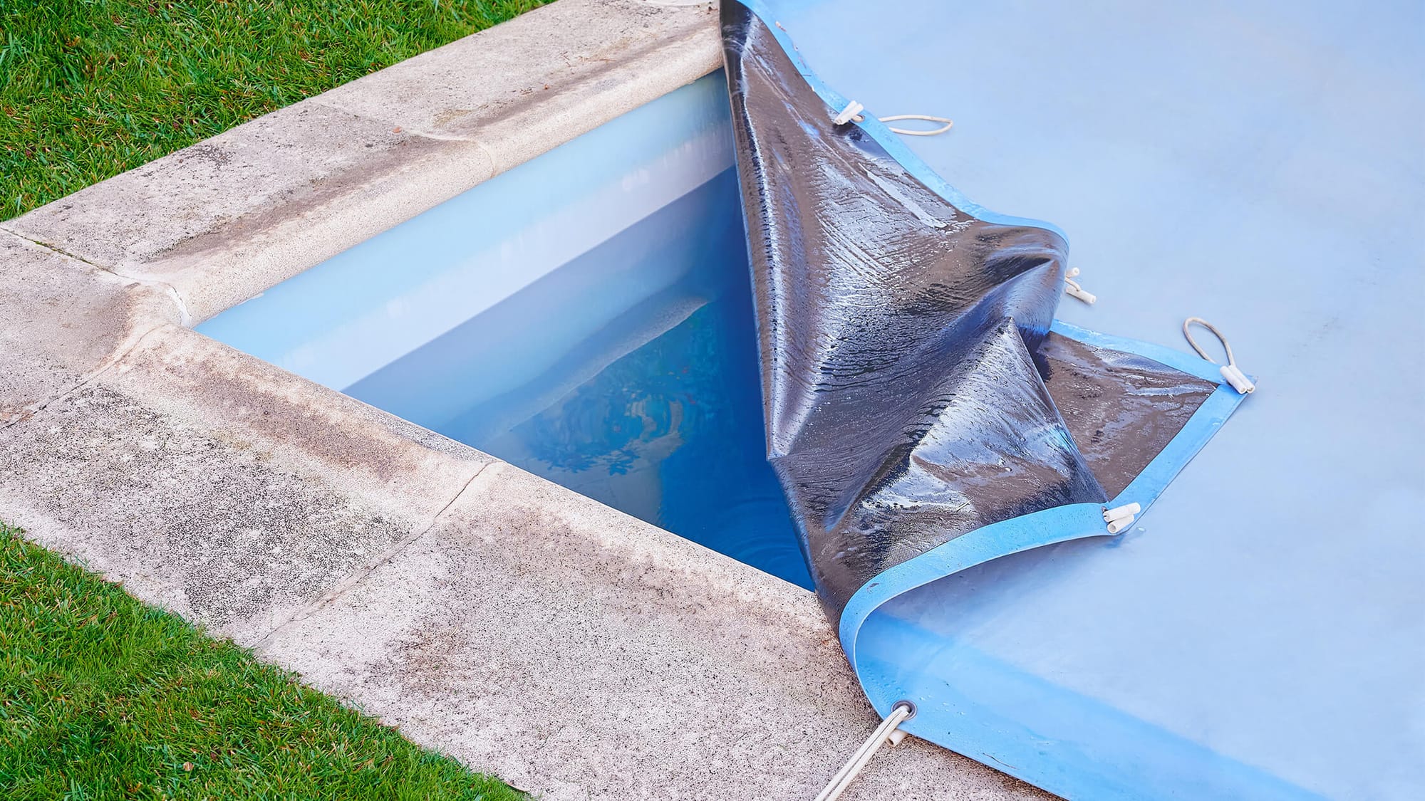 Worn pool cover needs replacement.