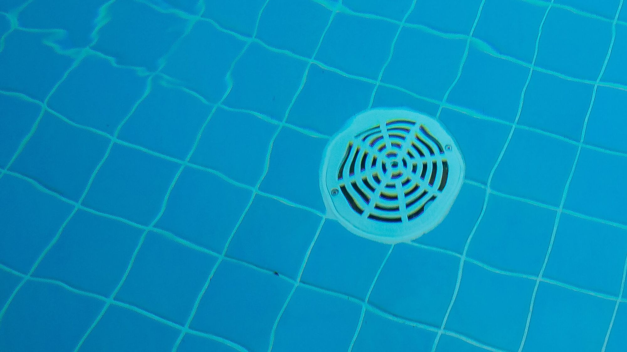 Floor drain at the bottom of the swimming pool.