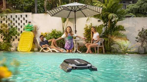 A family party next to their above ground pool