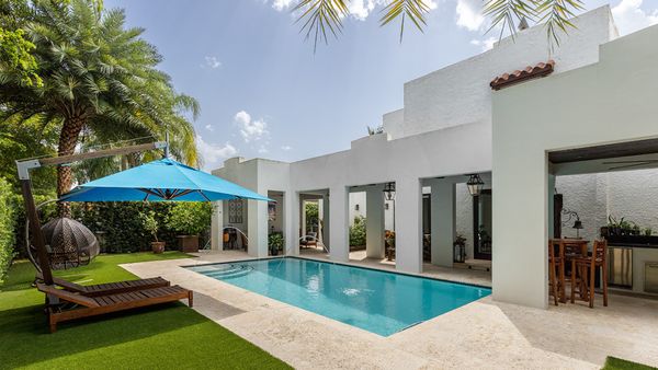 a modern backyard with a swimming pool