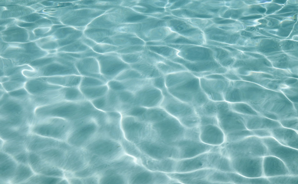 Clear blue swimming pool water surface