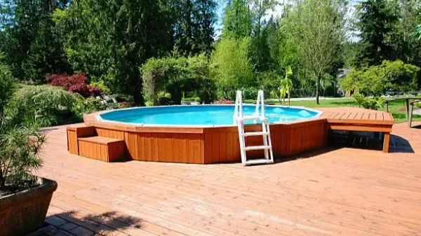 Above ground swimming pool installed on a properly leveled backyard base.