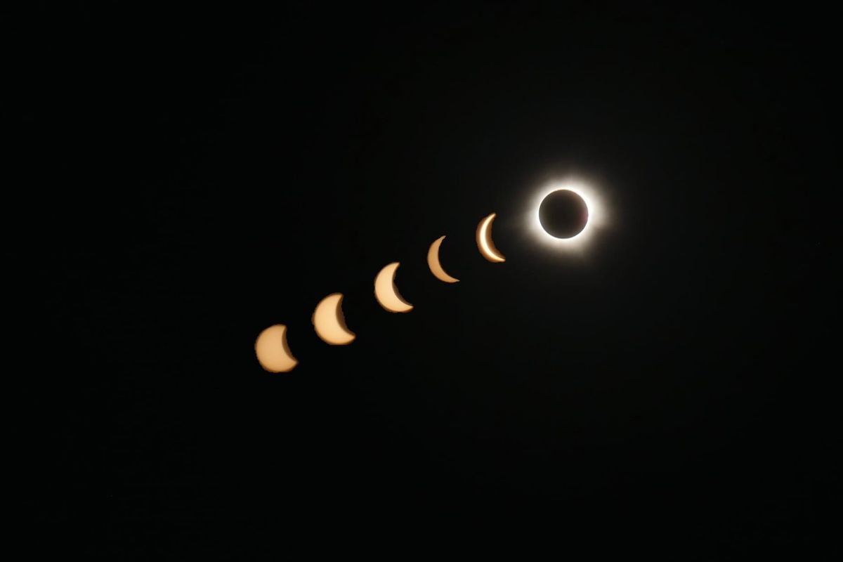 the Sun becoming slowly obscured by the Moon