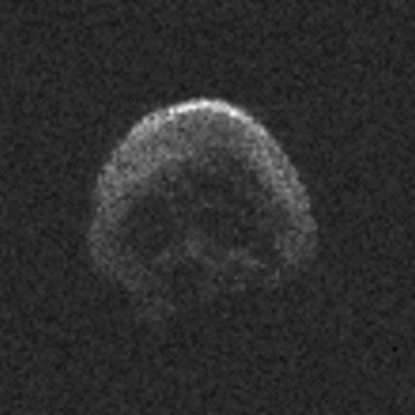 a very grainy image that seems a bit like  a skull on a pirate flag