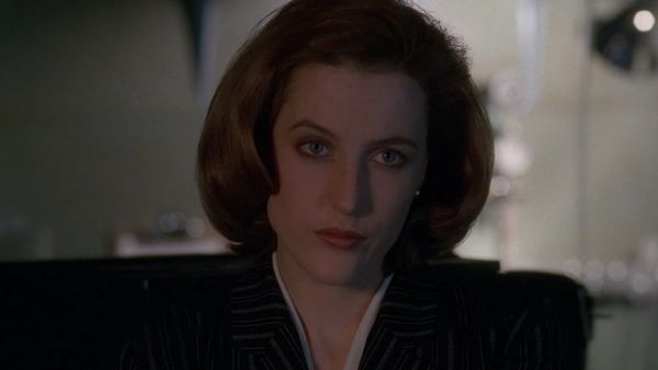 Dana Scully from the X-files looking skeptical right off camera)