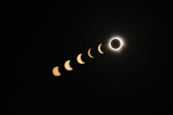 the Sun becoming slowly obscured by the Moon