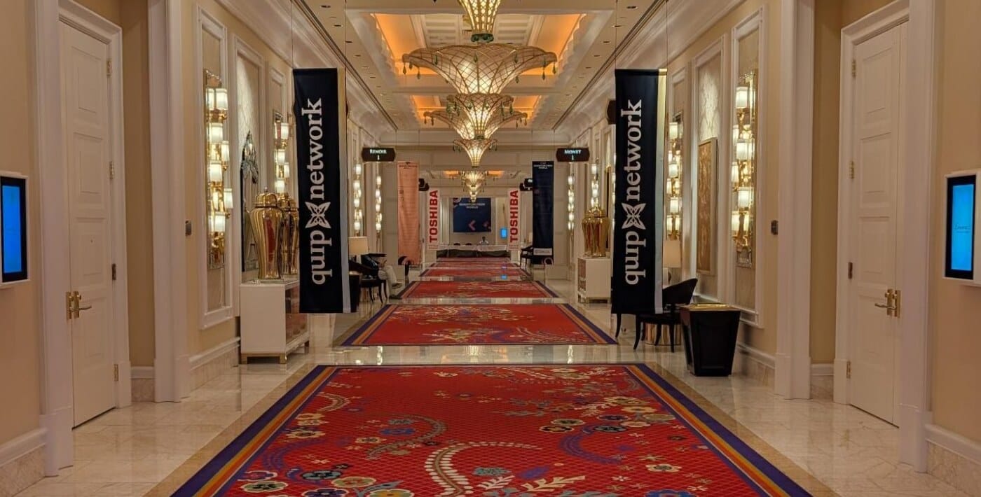 Quip Network banners along the main corridor into the exhibit hall.