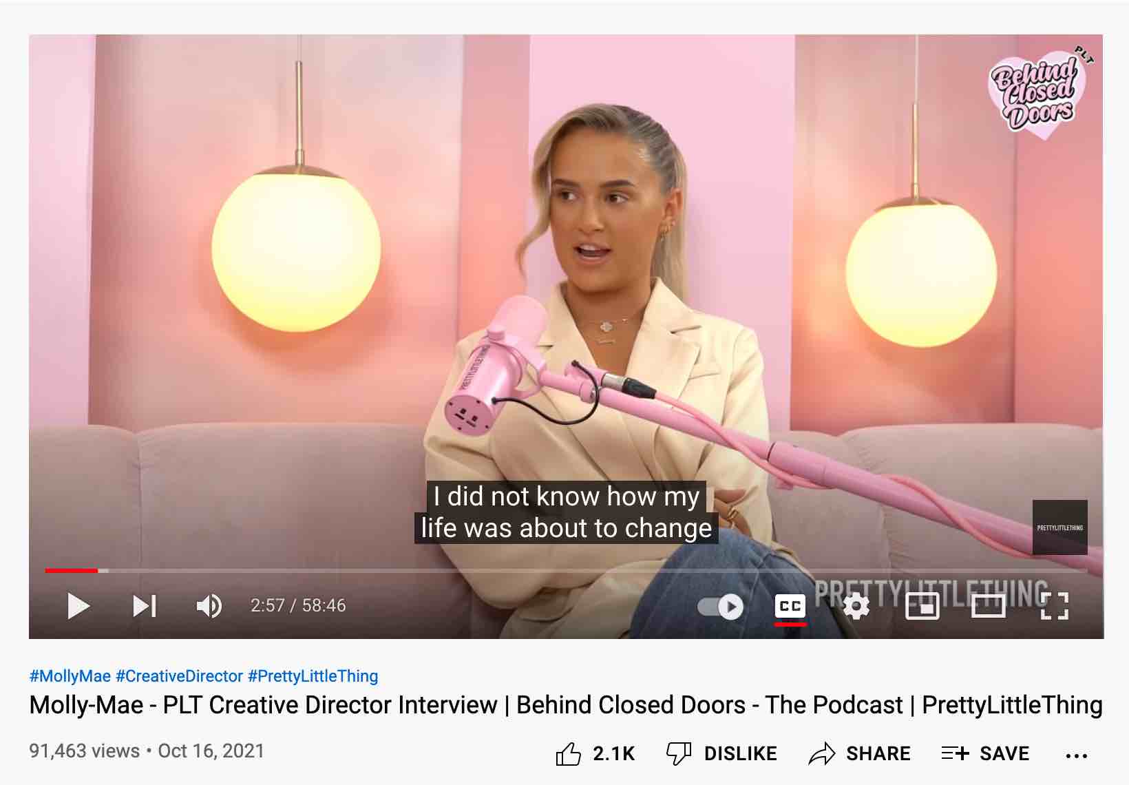 A shot of Molly Mae recording an episode of the PLT Behind Closed Doors podcast.