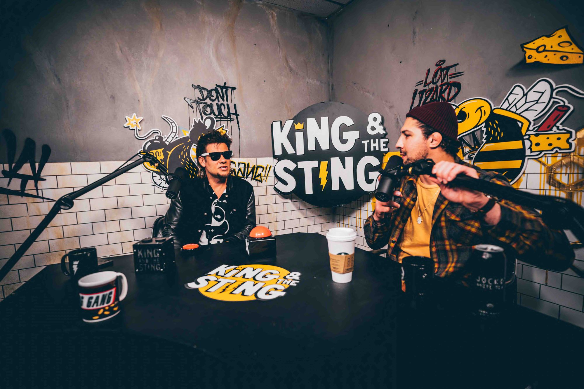 Two men recording a podcast.