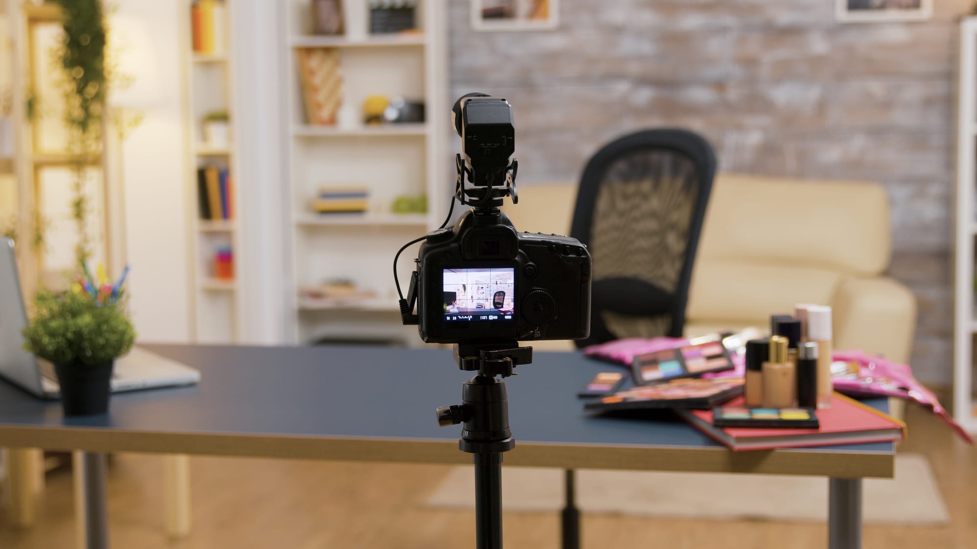 Behind a camera filming a recording setup